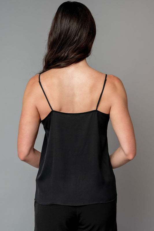 Woman wearing a black spaghetti strap top for choir, band, and orchestra musicians
