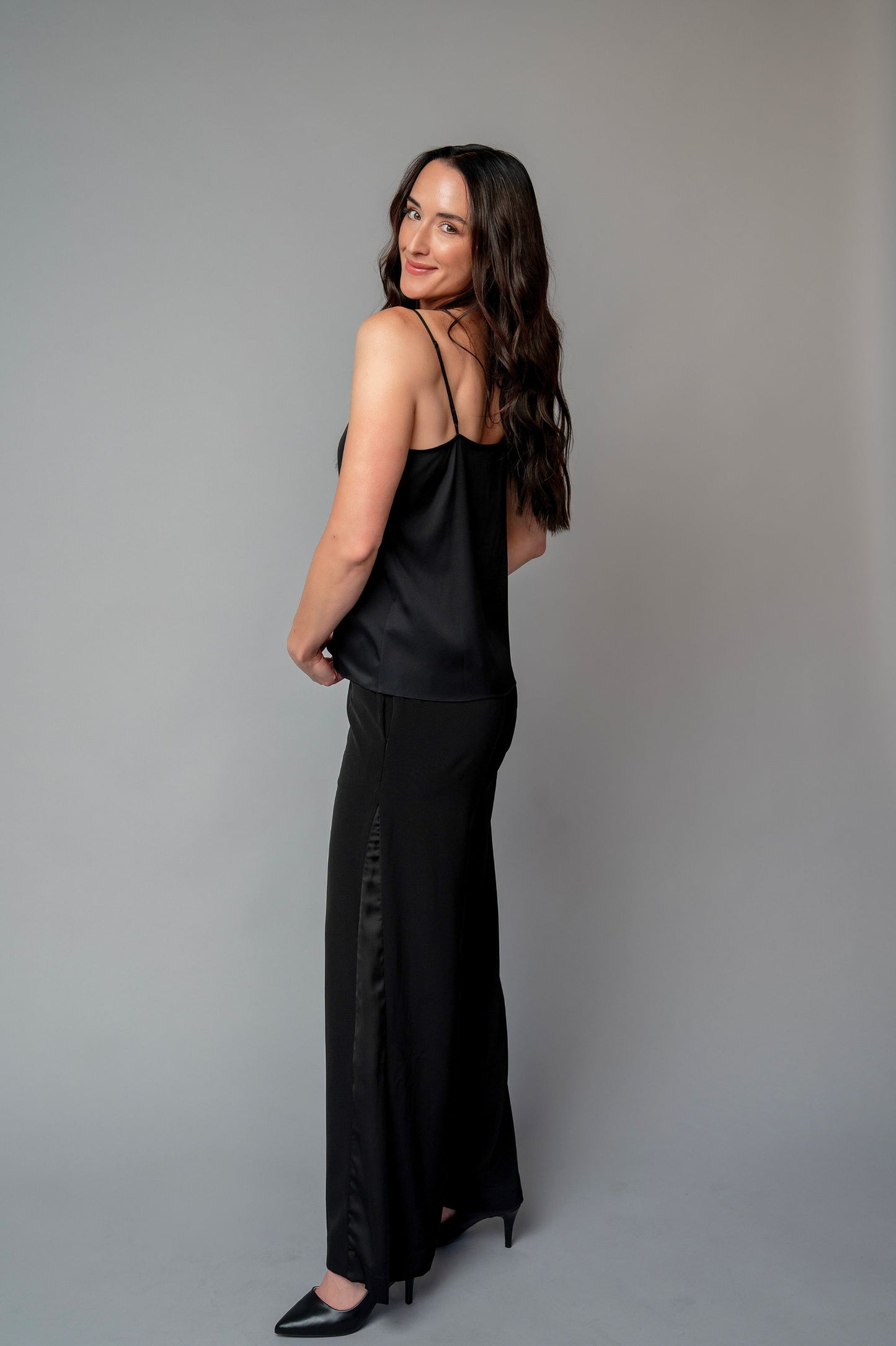 Woman wearing a black spaghetti strap top for choir, band, and orchestra musicians