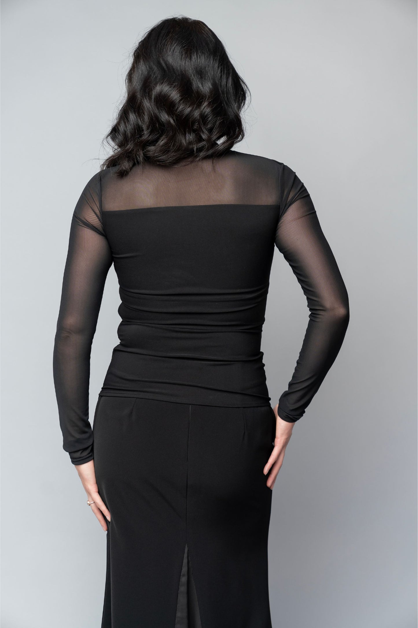 Asymmetrical black long sleeve blouse with sheer sleeves for choir, concert band and orchestra musicians.