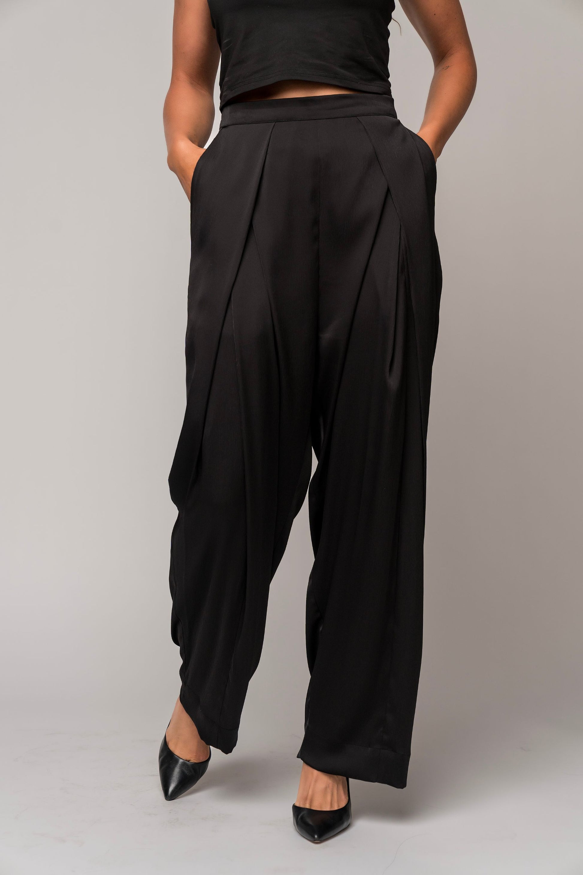 gender-neutral concert black pants in satin with deep pockets