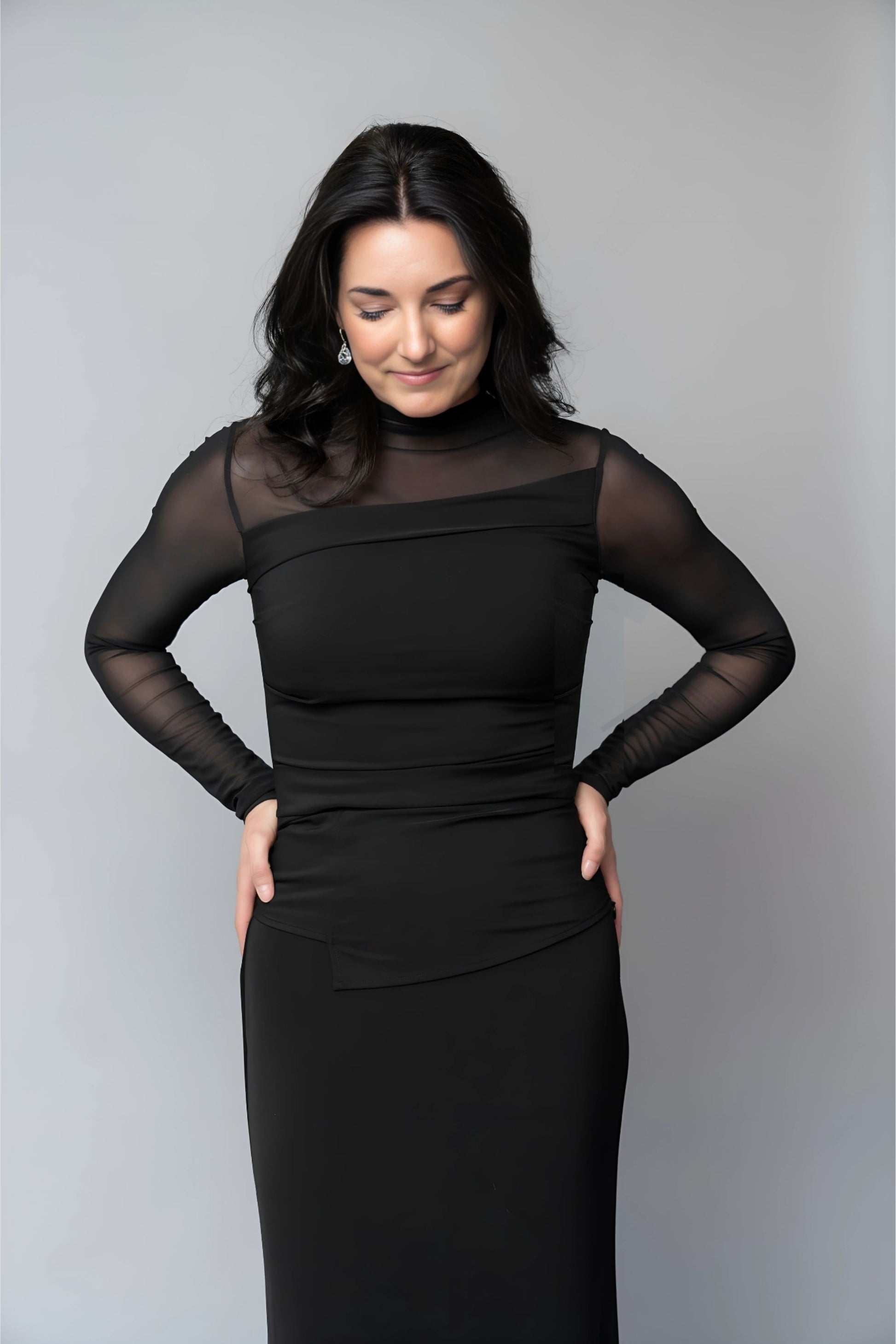 Asymmetrical black long sleeve blouse with sheer sleeves for choir, concert band and orchestra musicians.