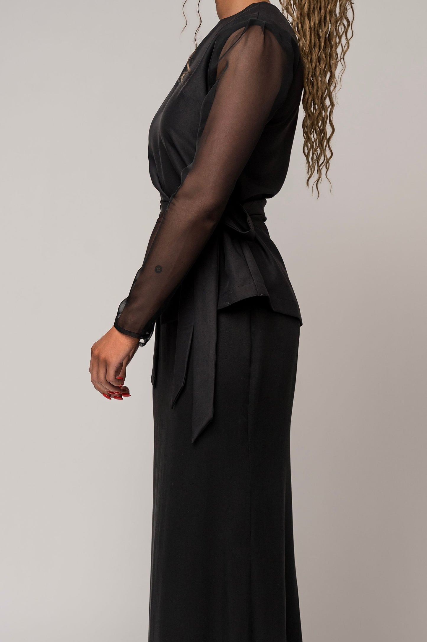 asymmetrical long sleeve black blouse with sheer sleeves